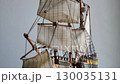 Rotation Of Sailing Masts Of Scale Model Wooden Ship On A White Background 4K Video 130035131