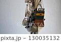 4K video of wooden sailboat scale model with fabric sails and thread ropes rotates around closeup 130035132