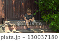 Child is angry and stomps foot while crossing arms on the porch during a hot summer day in dark clothes 130037180
