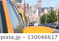 New York City. Row of yellow Taxi cars on street, Queens. Taxi cabs, Long Island. Medallion taxicab. 130046617
