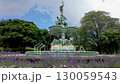 Camera rises from spring flowers to reveal Ross Fountain in Princes Street Gardens, Edinburgh. Shot on a summer day  130059543