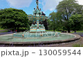 Camera tracks around Ross Fountain in Princes Street Gardens, Edinburgh. Shot on a summer day  130059544