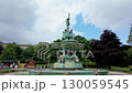 Camera tracks around Ross Fountain in Princes Street Gardens, Edinburgh. Shot on a summer day  130059545