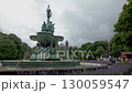 Static shot of Ross Fountain in Princes Street Gardens, Edinburgh with St Cuthbert Church in the background  130059547