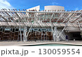 Pan across the front aspect of Holyrood Scottish Parliament in Edinburgh on a summer afternoon 130059554