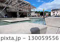 Camera rises to reveal front aspect of Holyrood Scottish Parliament in Edinburgh on a summer afternoon 130059556