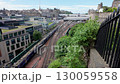 Elevated view of a train arriving in Waverley Station Edinburgh on a windy summer day  130059558