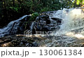Panning left following the cascading water from Pha Dok Siew Waterfall within Doi Inthanon National Park in Chiang mai, Thailand 130061384