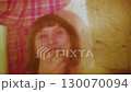 Retro video of a girl taking an apple and eating it. 130070094