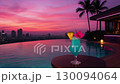 Cocktails at the poolside bar at night 130094064