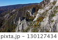Flying over limestone cliffs and autumn forest aerial view 130127434