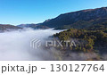 Aerial top down view of autumn misty forest canopy  130127764