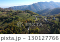Cars passing on mountain road in autumn aerial drone view 130127766