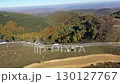Cars passing on mountain road in autumn aerial drone view 130127767