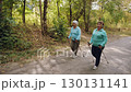 Elderly women Nordic walking outdoors 130131141