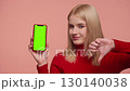 Dissatisfied customer giving thumbs down to mobile app 130140038