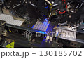 Electronic semiconductor industry. Close-up of robotic process of installing chips on panel. Industrial technological process of producing LED panels, lighting equipment. Automatic, high-tech machine. 130185702