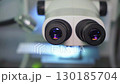 Close-up of microscope lenses. Microscope - front view. Medical equipment for scientific research in the field of medicine, as well as nanotechnology developments. 130185704