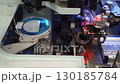 High-tech machine for installing chips on board. Nanotechnology robotic equipment at factory for production of LEDs, lighting fixtures. Close-up of automated work process of installing LED on panel. 130185784