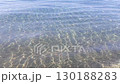 Transparent blue water surface. Clear rippled sea water. Sea slight waves.  130188283