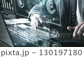 Glowing futuristic interface in front of businessman working on laptop 130197180