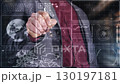 Businessman working with virtual touchscreen and global futuristic interface 130197181
