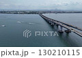 Drone aerial photography of cars and motorboats passing over Lake Biwa Bridge 130210115