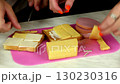 I put the ingredients on the sandwich with the cook's hands. 130230316