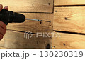 The master screws the screw into the board.  130230319