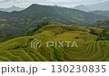 Aerial drone view flying forward and tilt up to reveal beautiful terraced rice fields, Vietnam 130230835