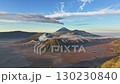 Aerial view fly back over kingkong hill to reveal Bromo volcano, Java, Indonesia  130230840