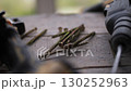 screws and drill on wooden table at construction site 130252963