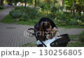 A Dog, a Baby, and a Beautiful Moment of Pure Joy During a Perfect Day in the Park 130256805