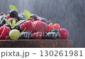 Water mist over a heap of different forest berries, black background with space for your text 130261981