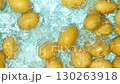 Organic Raw Potatoes Dropping Into Water Slow Motion Top View. 130263918