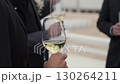 An Elegant Gathering of WellDressed Men at a Lavish Celebration Event Filled with Joy and Style 130264211