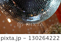 A stunning Sparkling Disco Ball adorned with beautiful Floral Decorations in a Chic Space 130264222