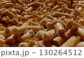 A cat litter box is filled with absorbent wood pellets designed for easy cleaning and odor control The litter looks fresh and is scattered evenly for comfortable use 130264512