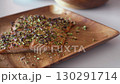 Grilled salmon fillets with crushed pistachios 130291714