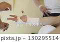 Coach wrapping boxer's hands with bandages 130295514