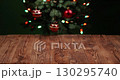 Celebrate Christmas With a Beautiful Tree and Twinkling Lights on a Wooden Surface 130295740