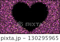 Sparkling pink particles like jewels shine around the heart-shaped cutout. 130295965