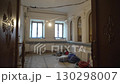 Room with arched windows shows renovation progress 130298007