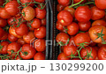 Fresh red tomatoes in black crates, ideal for markets or grocery-themed backgrounds video 130299200