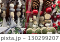 Christmas decorations with pinecones, baubles, and ribbons in a festive holiday market display video 130299207