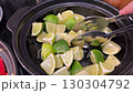 Lime wedges bowl Squeezed lime wedges in a white bowl 130304792