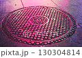 Neon-lit manhole 130304814