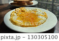 Fried eggs cooked in frying pan on camping gas stove 130305100