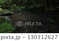 A waterfall leading to the Kikuchi Gorge with a clear stream flowing through nature 130312627