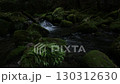 A waterfall leading to the Kikuchi Gorge with a clear stream flowing through nature 130312630